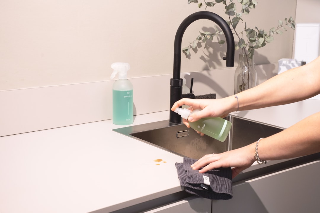 core-values a-woman-is-cleaning-a-kitchen-sink-with-a-rag-sqomdoqb3ws